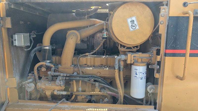 1999 Caterpillar 140H Motor Grader Engine Compartment Showing Air Cleaner Filter Housing and Fuel System