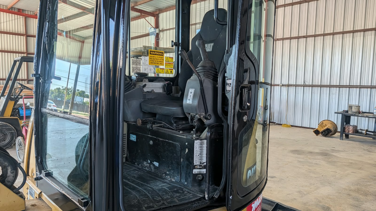 2015 Caterpillar 304E CR Mini Excavator Enclosed Operator Cabin Interior with High-Back Suspension Seat