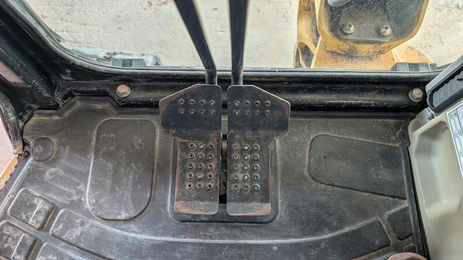 2015 Caterpillar 304E CR Mini Excavator Foot Pedals and Travel Control Levers Close-Up